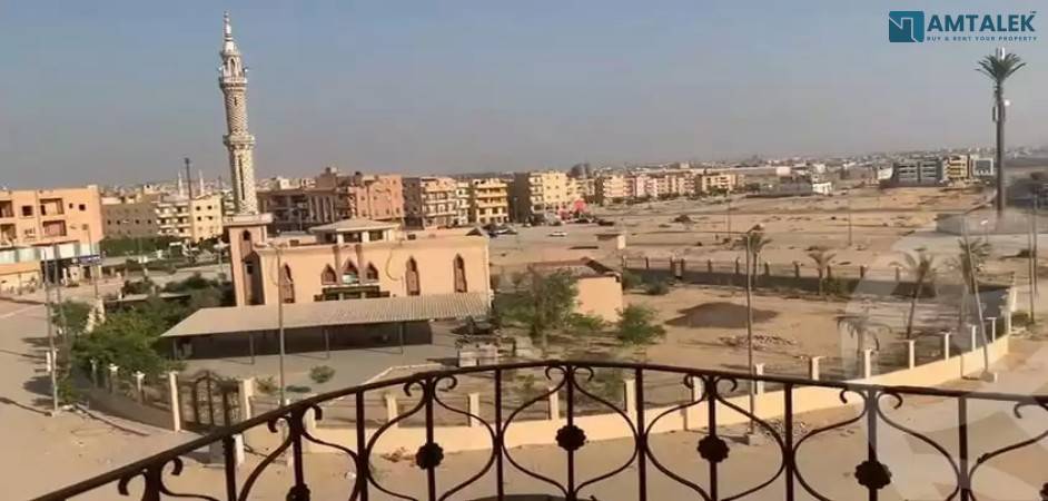 Apartment for sale in the Ninth District, on Abbas Al Akkad Street, red brick, in front of the second floor