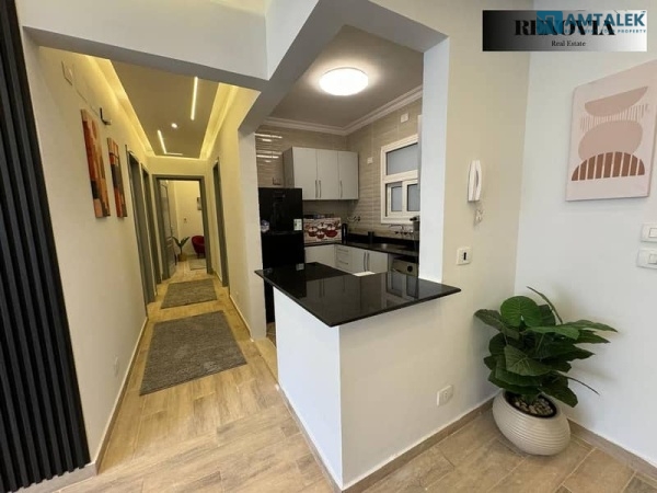 A distinguished apartment for rent, Fully Furnished, in a great location within Madinaty, featuring an open view of the garden and the iconic tower.