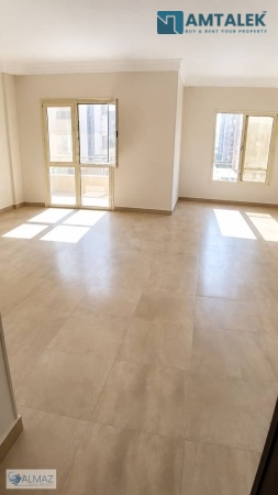 Unfurnished 220 sqm apartment for rent in Al Banafseg Buildings, First Settlement, directly on North 90th Street