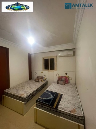 Furnished apartment for rent in New Maadi, upscale location near the metro station and Sawaris Square, fifth floor, 2 elevators
